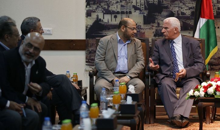 Senior Hamas leader Abu Marzouk and Al-Ahmed, a senior Fatah official talk during their meeting in Gaza City